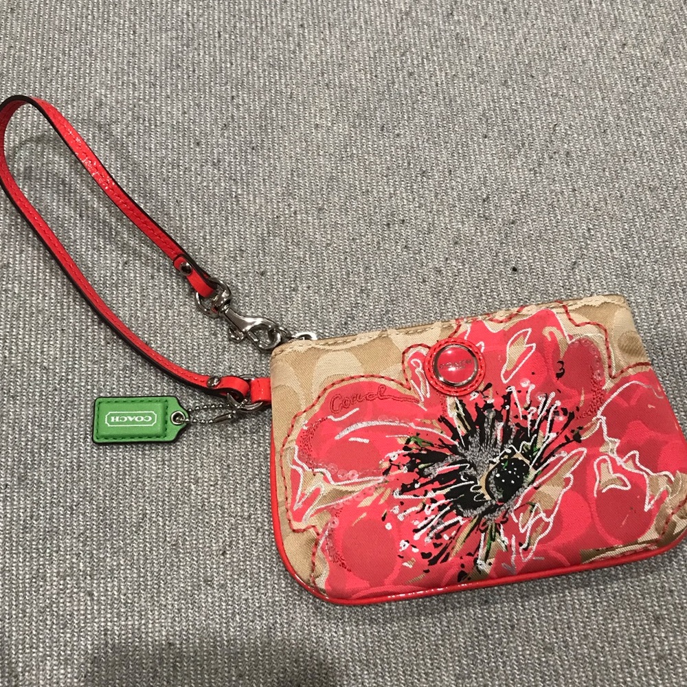 Coach wristlet with tan signature c and flower